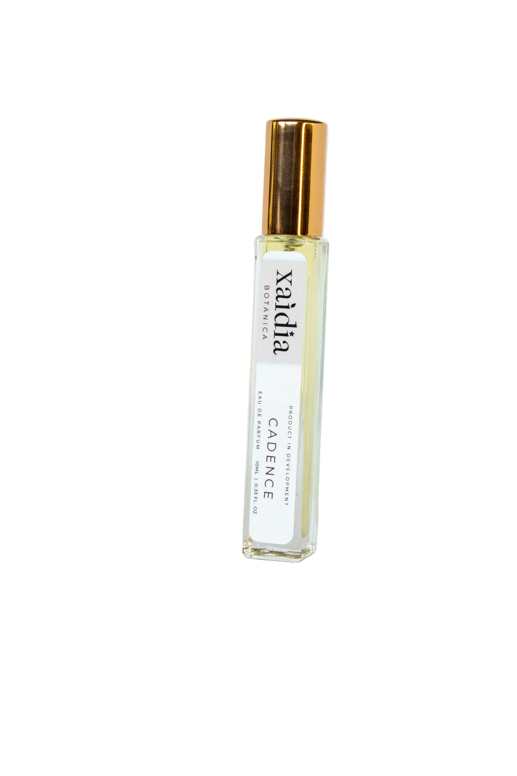 Small perfume bottle with gold cap on a white background